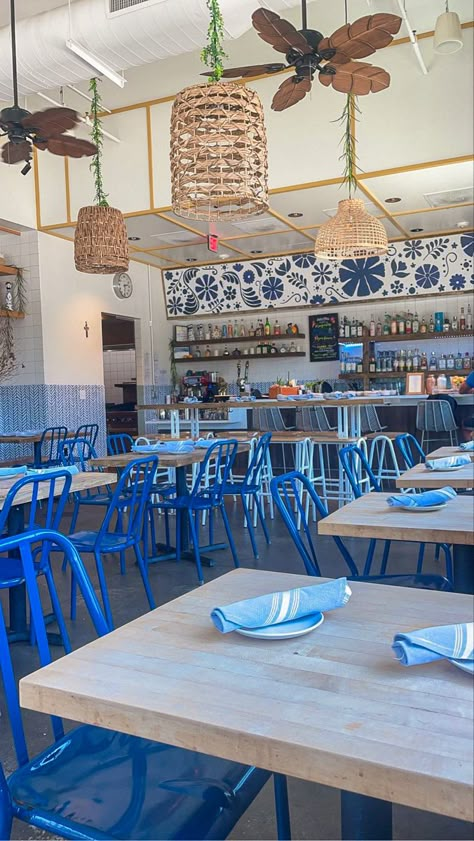 Costal Restaurant, Coastal Restaurant Interior, Blue Restaurant Exterior, Blue Restaurant, Blue Cafe Aesthetic, Beach Vibe Restaurant, Light Blue Cafe Aesthetic, Beach Restaurant Aesthetic, Orange And Blue Restaurant Interior