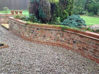 Garden Brick Wall, Brick Retaining Wall, Brick Garden Wall, Retaining Wall Bricks, Maria Burton, Brick Wall Gardens, Wood Retaining Wall, Backyard Retaining Walls, Retaining Wall Design