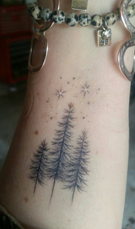 Pine Tree With Flowers Tattoo, Dainty Forest Tattoo, Outdoor Family Tattoo Ideas, Trees And Stars Tattoo, Delicate Tree Tattoos For Women, Tree And Stars Tattoo, Winter Sleeve Tattoo, Winter Tattoos For Women, Snowy Tattoos