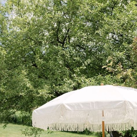 BBJ La Tavola on Instagram: "Step into a dreamy setting of elegance and sophistication, where delicate lace linens meet lush blue and white florals. The whimsical fringe umbrella adds a touch of charm, creating a picturesque scene perfect for any celebration. 🌸✨

Featuring our Charlotte White Overlay, Sonoma Ice Blue Table Linen and Sonoma Ice Blue Napkin. Visit the link in our bio to view more of this elegant linen. 

__________ 
Credits:
Planning/Design: @gather_planning 
Photo: @alyssafloodphoto 
Florals: @beckandforthco 
Catering: @shans_table 
Cake/Desserts: @thecakeshop_cny 
Cake pops: @cakepopsbymelissa 
Linens: @bbjlatavola" Fringe Umbrella Wedding, Cny Cake, Fringe Umbrella, Blue And White Florals, White Overlay, Blue Napkins, Umbrella Wedding, White Florals, Sun Umbrella