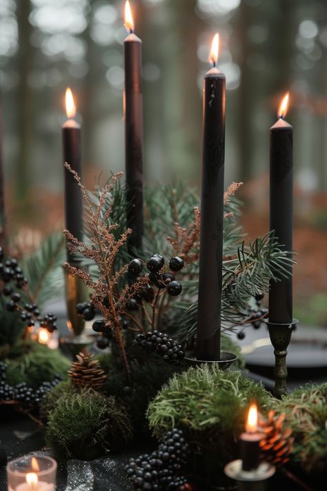 Moody wedding centerpieces feature deep colors and rich textures for a dramatic effect. Get inspired here. Greenery With Candles Wedding, Wedding Black Candles, Masculine Tablescape Party Ideas, Gothic Wedding Reception Decor, Moody Garden Party Wedding, Black And Green Winter Wedding, Dark Moody Tablescape, Dark Green Christmas Wedding, Dark Acadamia Weddings