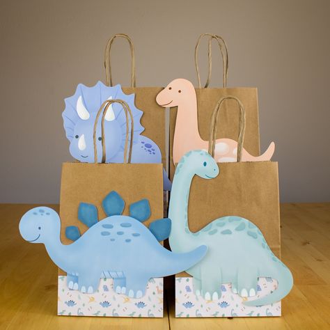 Dinosaur Favor Bags.  PRODUCT DETAILS DIMENSIONS : Size: 5.25 x 3.75 x 8 Inches You can find more Dinosaur theme products: https://www.etsy.com/shop/Ducktoparty?ref=seller-platform-mcnav&section_id=42727042 Make sure to type correctly. Our items are handmade with exclusive designs to make your celebration unique and original.  You may see colors in different shades depending on your computer's resolution.  * This item comes with the items listed. The pictures are just for reference. Dinosaur Party Favors Bags, Dinosaur Birthday Pictures, Dinosaur Gift Bags, Dino Party Favors, Dinosaur Favor Bags, Dino Party Decorations, Baby Dinosaur Party, Birthday Party Dinosaur, Dinosaur Favors