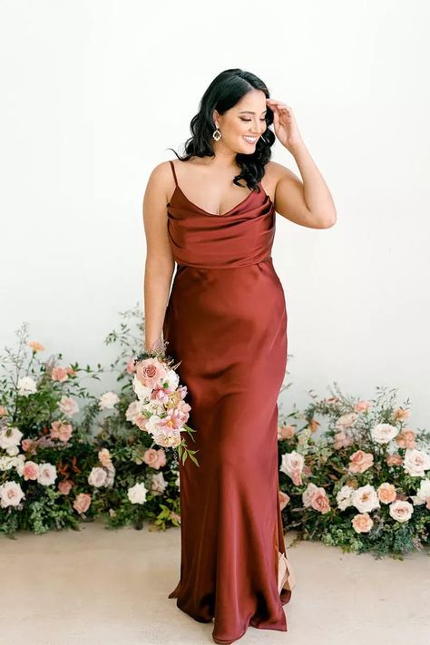 There are a lot of details to love about this chic Revelry bridesmaid dress, from the cowl neck and knee-high slits to the ruched bodice and shiny satin fabric. Bonus: it's available in a wide range of sizes and 20+ colors including this rust/terracotta that's perfect for a romantic spring or summer wedding. Click the link for more of our favorite terracotta and rust bridesmaid dresses. // Photo: Revelry Rust Bridesmaid Dress, Sleeveless Bridesmaid Dresses, Plus Size Bridesmaid, Maxi Bridesmaid Dresses, Bridal Party Dresses, Evening Dresses For Weddings, Long Bridesmaid Dress, Satin Bridesmaid Dresses, Dress Spaghetti