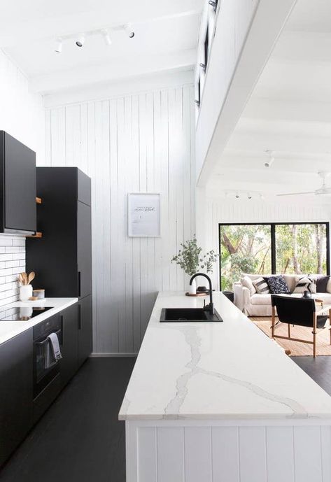 Black is a color that's permeating nearly every square inch of homes these days. From bathrooms to bedrooms to even exteriors, it's a surprising hue that looks decidedly cool and modern. Here are seven ideas for black kitchen floors that we adore. #hunkerhome #kitchenfloor #kitchen #floor #blackfloor Black Kitchen Floor Tiles, Black Kitchen Floor, Light Kitchen Floor, Kitchen Floor Ideas, Black Tiles Kitchen, Modern Kitchen Tile Floor, Kitchen Floor Tile Design, Modern Kitchen Flooring, Kitchen Flooring Ideas