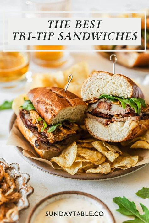 These tri-tip sandwiches have garlic aioli, fried onions, provolone, and arugula for an easy, gourmet sandwich! Use smoked or grilled tri-tip in this recipe, or use leftover steak to make things super easy. If you're not a fan of garlic sauce, try chimichurri or horseradish instead. These sandwiches are perfect for dinner and they're huge crowd-pleasers. They're one of my favorite meals for a crowd. Just whip them up and enjoy with sides like potato chips, pasta salad, potato salad, and more! Tri Tip Sandwich Ideas, Beef Tri Tip Recipes, Tritip Sandwich, Meals For A Crowd, Tri Tip Sandwich, Beef Tri Tip, Salad Potato, Leftover Steak, Burger Dogs