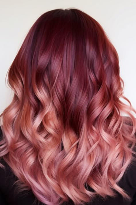 Transitioning from burgundy to a softer rose gold, this ombre look is a captivating bright burgundy balayage option. It’s best for those with mid-length hair and works well with a middle part. Click here to check out more stunning burgundy balayage hair ideas trending right now. Burgundy To Rose Gold Ombre Hair, Burgundy To Pink Ombre Hair, Maroon Blonde Balayage, Burgundy Shadow Root, Burgundy And Rose Gold Hair, Mid Length Haircut Red Hair, Copper Red Hair Color Balayage Rose Gold, Red To Pink Balayage, Pink Red Balayage