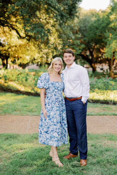 Rice Unversity Egagement Session Outfits  Blue & White Floral Print Dress with Puff Sleeves White Button-Up with Navy Blue Slacks Engagement Photos Outfits Blue Dress, Navy Blue Couple Outfits Wedding, Navy Blue Slacks, Blue Slacks, White Photoshoot, Engagement Picture Outfits, Rice University, Centerpieces Diy, White Floral Print Dress