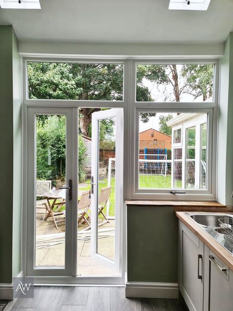 Outswing French Doors With Screens, Window Next To French Doors, Back Door And Window Ideas, Kitchen With Side Window, Small Kitchen With French Doors To Patio, Glass Door With Windows On Side, Kitchen Doors To Outside Patio, Doors In Kitchen To Outside, Backdoor In Kitchen