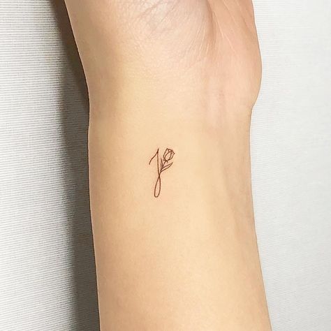 If matching couples' tattoos are a bit too much for you, scale it back with a simple letter of your partner's first name. Getting their initials inked is a Tiny Initial Tattoo Placement, Initial Tattoo Couple, Simple J Tattoos, Dainty Love Tattoos, Simple J Tattoo, Couples Tattoos Initials, Initial With Rose Tattoo, Letter I Tattoo Ideas, Minimal Tattoo Initials