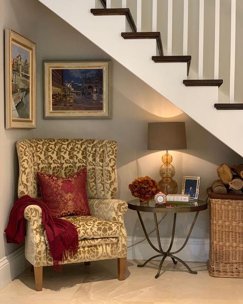 I decided to make good use of the space under the stairs in this family home project. The wing chair from @davidseyfried is now a real… Decorate Under Staircase, Staircase Under Ideas Interior Design, Under Stairs Cosy Nook, Under Stairs Decoration Ideas, Showcase Under Staircase, Under Stair Cubby, Under Staircase Book Nook, Under The Stairs Ideas, Under Stairs Nook