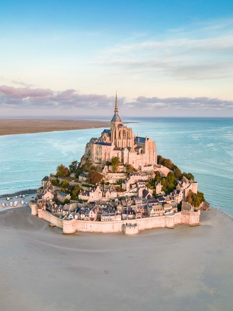 Mont Saint-Michel, a formidable fortress commune in France. The island of Mont Saint Michel and its super tides are a place of tales! Mont Saint Michel France, Places In Europe, World Heritage, Terrace, Things To Do, A Place, Tower, France, Tour De France