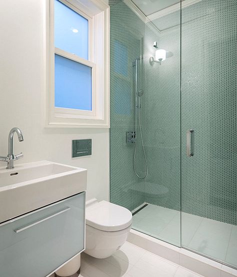 Let’s start with clean lines. One tactic for making the most of a compact space involves the use of uncluttered, refreshing design. Modern fixtures, cool-toned tile and glass shower doors create a contemporary clutter-free statement, as shown in the powder room below. Makeover Kamar Mandi, Very Small Bathroom, Small Bathroom With Shower, Modern Small Bathrooms, Small Space Bathroom, Small Bathroom Makeover, Decor Baie, Tiny Bathrooms, Small Bathroom Design