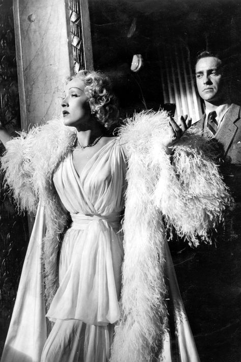 LOOK TO THE STARS Monsieur Dior had an undying love for the cinema; his friendship with Marlene Dietrich yielded legendary film costumes, such as those seen in Stage Fright (pictured). Today, several of Hollywood's most recognizable faces represent the fashion house, including Jennifer Lawrence, Marion Cotillard and Natalie Portman.   - HarpersBAZAAR.com Tippi Hedren, Film Cult, Stage Fright, Alfred Hitchcock Movies, Edna Mode, Janet Leigh, Undying Love, The Cinema, Marlene Dietrich