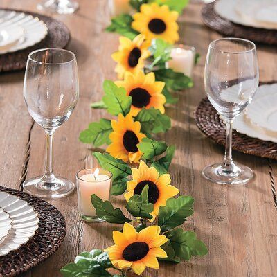 Add a sunny, festive air to your party decorations with this great Faux Sunflower Greenery Garland. These bright and fun flowers make an awesome backdrop at your wedding ceremony or wedding reception, or any special event. Attach this garland to an arch under which you'll take your vows! | Primrue 6' Greenery Garland | 9.2 H x 72 W x 1 D in | Wayfair Sunflower Party Ideas, Red Sunflower Wedding, Sunflower Garland, Sunflower Birthday Parties, Baby Shower Girl Diy, Sunflower Wedding Decorations, Sunflower Birthday, Sunflower Centerpieces, Sunflower Theme