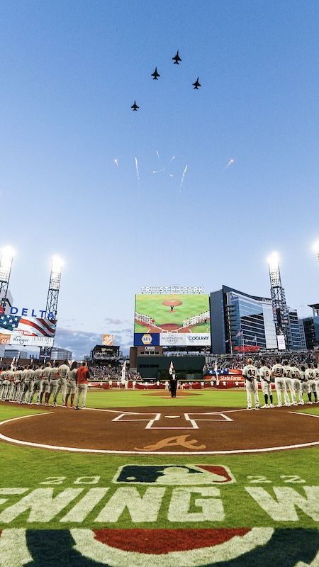 Planes fly over Truist Park during the National Anthem, as players line up on the first and third base lines. Opening Day 2022. Atlanta Braves Aesthetic, Braves Aesthetic, Braves Wallpaper, Sports Aesthetics, Atlanta Braves Wallpaper, Brave Wallpaper, Truist Park, Ball Photos, Major League Baseball Stadiums