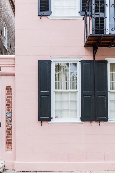 Charleston doors: Pink house with black shutters Charleston Doors, House With Black Shutters, Pink House Exterior, Coastal Home Exterior, Pastel Interior Design, Townhouse Exterior, Black Shutters, Exterior House Color, Shutters Exterior