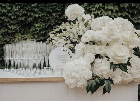 White Bar Arrangement, White Console Table Decor, Wedding Bar Floral Arrangements, Bar Florals Wedding, Morgan Turner, Wedding Bar Flowers White, White Flowers Rectangle Table, Bar Arrangement, All White Floral Installation