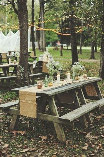 Getting married in a park? A simple runner over a picnic table elevates it to wedding-ready. Picnic Tables Ideas, Picnic Table Wedding, Simple Picnic, Wedding Reception Outdoor, Wedding Reception On A Budget, Campground Wedding, Pavilion Wedding, Backyard Seating, Picnic Style