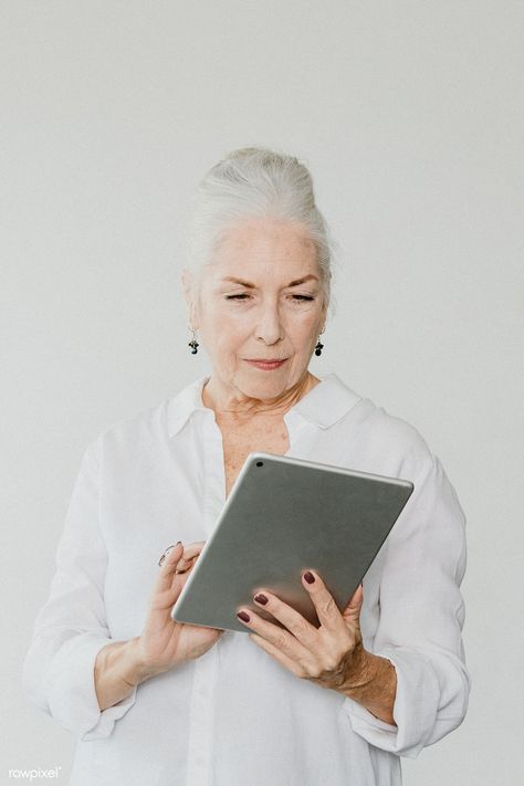 Senior woman using a digital tablet in a white room | premium image by rawpixel.com Senior Fashion, Cricket Wireless, Retouching Photoshop, Digital Tablet, Smart Women, White Room, Senior Citizen, How To Take Photos, Design Resources