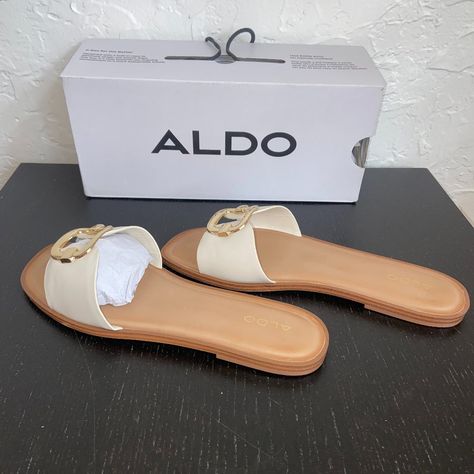 A Classic Slide Sandal With An Elevated Twist, These Comfy Square Toe Slip-Ons Feature A Chic Metal Ornament For That Extra Touch Of Style! Materials Upper: Synthetic Sole: Rubber Details: Slide Sandal Square Toe Slip On Metal Ornament Https://Www.Aldoshoes.Com/Us/En_us/Glaeswen-White/P/13191287 Aldo Sandals, White P, Only Shoes, Metal Ornament, Aldo Shoes, Slip Ons, Womens Slippers, Slide Sandals, Girls Shoes