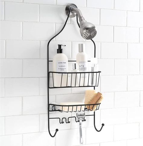 Introducing our Bath Bliss sleek and stylish matte black shower caddy, designed to hang effortlessly over your shower head. With two spacious shelves, you'll have ample room to store all your shower essentials. Plus, two towel hooks and two razor hooks provide additional storage options, keeping your bathroom clutter-free. This caddy is also equipped with suction cups in the back to stabilize and secure it in place, ensuring a safe and reliable storage solution for all your shower essentials. Black Shower Caddy, Shower Dimensions, Bathroom Clutter, Shower Essentials, Bath Caddies, Shampoos And Conditioners, Bath Store, Black Shower, Bathroom Items