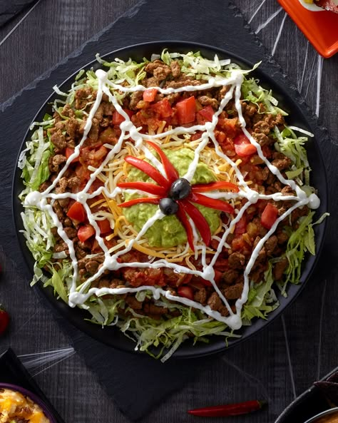 Halloween Nacho Dip, Spiderweb Taco Dip, Halloween Coleslaw, Halloween Nachos Ideas, Spooky Nacho Bar, Spooky Mexican Food, Halloween Nacho Bar Ideas, Spooky Nachos, Halloween Salad Ideas