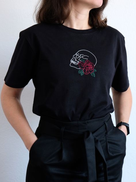 High-quality cotton t-shirt in black with hand embroidered skull and red rose. It's comfortable and flattering for both men and women. - Unisex organic heavy t-shirt by EarthPositive; - Fabric: 100% certified organic cotton, 190 gm², Premium, Fairwear, Green Fashion; - Fit: regular (normal). Hand Embroidered Shirt, Dark Academia Shirt, Embroidered Skull, Skull Shirt, Skull Shirts, Shirt Embroidery, Skull Design, Embroidered Shirt, Green Fashion