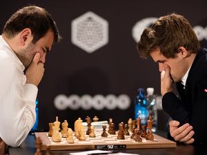 World chess champion Magnes Carlsen (right) won't play his computer or play the game like a computer. Instead, he chooses his strategy based on what he knows about his opponent. Magnes Carlsen, People Playing Chess, Chess Competition, Chess Champion, Chess Art, Garry Kasparov, Giving Back To The Community, How To Play Chess, Playing Chess