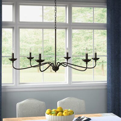 Complete your home décor with this product. Showcasing a matte black finish, it features six elegant lightbulb sockets to beautifully illuminate your space. With a cord length of 72-inches and an adjustable base, this transitional style chandelier must be hardwired to your ceiling, could be a sloped ceiling. The simple yet elegant design of this metal chandelier provides a sophisticated update to your dining room décor. Six type-b 60-watt incandescent bulbs( are not included.) Finish: Black | Re Hammock House, Cabin Vibes, Kitchen Lights, Classic Chandelier, Foyer Lighting, Wagon Wheel Chandelier, Hanging Chandelier, Candle Style Chandelier, Wayfair Furniture