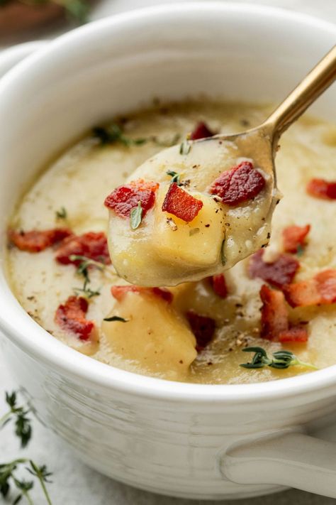 Imagine all the delicious flavors of a loaded baked potato coming together in one amazing bowl of good-for-you soup. This Creamy Potato Leek Soup with Bacon recipe is a bit on the magic side, being creamy without the addition of milk or cream. It's all due to the combination of boldly flavored real-food ingredients, a simple technique, and (what we think is) one of the very best uses for leeks! Cream Of Leek Soup, Potato And Leak Soup, Leek And Bacon Soup, Creamy Potato Leek Soup, Leeks Soup Recipes, Soup With Bacon, Potato Bacon Soup, Real Food Dietitians, Potato Soup Easy