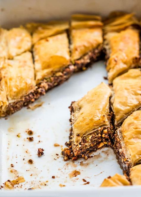 This Chocolate Baklava is one of my favorite desserts. Sweet, crisp and buttery layers of phyllo filled with pistachios, walnuts, almonds, hazelnuts and Nutella, baked to perfection then drizzled with a sweet honey syrup. www.jocooks.com #baklava Steakhouse Desserts, Chocolate Baklava, Phyllo Recipes, Baklava Recipe, Egyptian Food, Honey Syrup, Yogurt Recipes, Candy Desserts, Köstliche Desserts