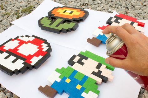 8-bit Super Mario Brothers wooden block pixel art pattern | Chica and Jo Block Pixel Art, Letter Painting Ideas Wooden, Nintendo Crafts, Gaming Crafts, Wooden Blocks Diy, 4h Crafts, Video Game Crafts, Mario Crafts, Mario Room