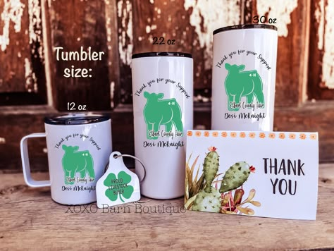 "A perfect way to say \"Thank You\" to your new Livestock Buyer! This 4-H gift set is a perfect way to show your appreciation to your new livestock buyer. This gift set includes personalized mug or tumbler, a \"Proud Livestock Buyer\" keychain and a Thank You card. This set will be cherished for years to come and will be the envy of other buyers. These dishwasher safe items come in different sizes: Tumbler: 12 oz, 22 oz OR 30 oz Double sided metal \"Proud Livestock Buyer\" keychain with a cable. 4h Gift Ideas, Buyer Gifts For Fair, Buyers Baskets 4-h, 4h Buyer Thank You Gift Ideas, Buyer Basket Ideas For 4h, Buyers Letters For Fair For 4h, 4h Livestock Pen Decorations, 4h Buyers Letters Ideas, Ffa Thank You Gifts