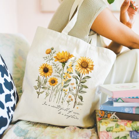 𝑽𝒊𝒏𝒕𝒂𝒈𝒆 𝑺𝒖𝒏𝒇𝒍𝒐𝒘𝒆𝒓𝒔 𝑻𝒐𝒕𝒆 𝑩𝒂𝒈 🌻 "In a world full of roses, be a sunflower" 🌻 Hey Sunflowers lover, show off your love for Flowers with our Vintage Sunflowers Tote Bag. The perfect Floral tote for who loves enjoy a ride at the sunset in summer 🌅 • Tote Bag color: Natural • 100% Cotton • Flat corners • Cross stitching on handles You can find this Tote Bag in my Etsy Shop! 🤍 👉🏻 link in Bio #totebags #totebagstyle #totebagdesign #totebag #vintagetotebag #sunflowers🌻 #sunflowers #sunflowerbag #bag... Painted Fashion, Be A Sunflower, Bag Painting, Flower Tote Bag, Flowers Tote, Vintage Tote Bag, Summer Tote Bags, Summer Tote, Hot Picks