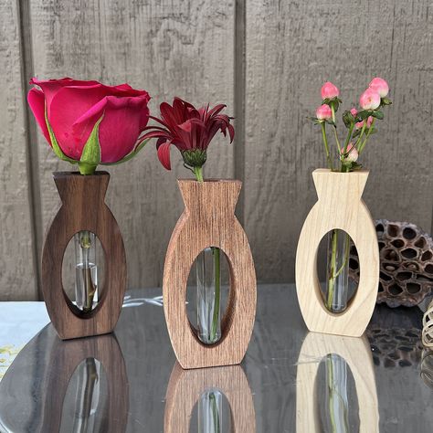 "The Mid-Century Modern look and feel of these tiny treasures is just so satisfying.  If you are looking for a show stopping gift at a low price, look no further. No one but you needs to know how affordably you go it. We craft these vases from reclaimed hardwoods in our home shop and so each one is just a little different. Because these are made from reclaimed wood, we are able to keep the prices affordable.  Measures approximately 4.5\" tall and comes with a glass test tube. Finished with our o Wood Small Crafts, Small Wood Gifts, Wood Gift Ideas, Test Tube Crafts, Single Stem Vase, Unique Best Friend Gifts, Flower Vase Design, Test Tube Vase, Romantic Gifts For Wife