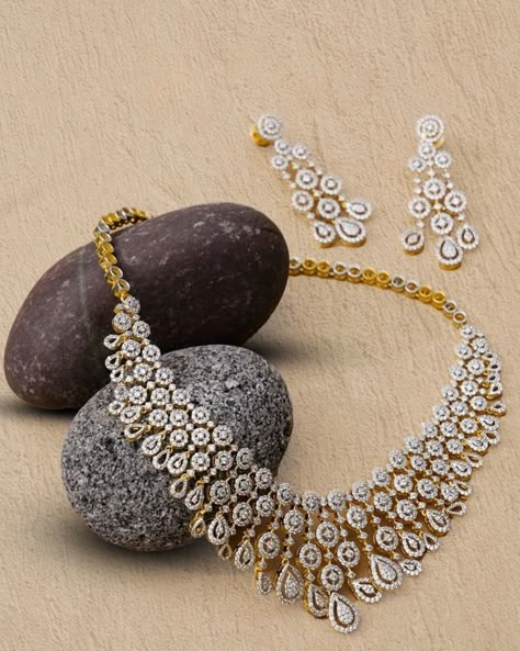 This luxuriant neckpiece features round and pear-shaped diamonds. With its dreamy design and excellent craftsmanship, this piece is sure to steal the show. Get in touch with us now for more customized jewelry. . . . . . . . #customizeddiamondnecklace #diamondnecklacedesigns #custommadejewelry #custommadegifts #jewelrydesigner #atlantajewelry #pearshaped #rounddiamond #diamondcluster #necklaceset #highendjewelry #regalstudio #regaljewelry Ad Necklace Sets, Gold And Diamond Necklace Set, Indian Diamond Jewellery Set, Indian Diamond Necklace Set, Bridal Diamond Jewellery Set, Diamond Jewelry Designs Indian, Diamond Sets Necklace, Diamond Necklace For Wedding, Real Diamond Bangles Designs