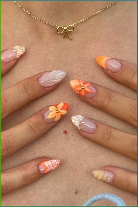 Looking for trending new nail designs to try out? 3D flower nails are where it's at right now with their insanely gorgeous designs. These tropical nail designs will have your jaw on the ground! Lowkey the perfect vacation nail ideas to try out. Orange Seashell Nails, Trendy Summer Nails 2024, Warm Nails, Summer Orange Nails, Orange Nails Ideas, Summer Nails Orange, Orange Summer Nails, Detailed Nails, Vacation Nail Ideas