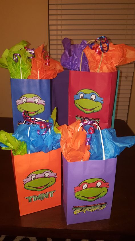 Custom Teenage Mutant Ninja Turtle Goodie Bags...  All bags include a theme cup, a bag of candy, a glow bracelet and lanyard, theme stickers, Play-doh, and bubbles.  Additional items, labels, and gift tags can be included for an additional charge! Ninja Turtles Goodie Bags, Ninja Turtle Candy Bags, Ninja Turtles Goody Bag Ideas, Ninja Turtle Goodie Bag Ideas, Turtles Birthday Party Ideas, Ninja Turtles Birthday Party Ideas, Ninja Turtle Theme Party, Ninja Turtle Birthday Cake, Birthday Party Ideas For Boys