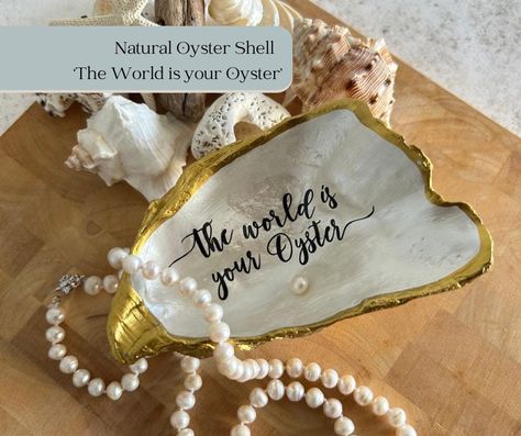 'The world is your oyster' saying is often said to young people about to embark on adult life. It simply means that everything is open to them if they are lucky they could encounter something special. Each shell is unique; this gold oyster shell is set with a freshwater pearl and finished with a rich gold acrylic to give a luxurious feel. A pearl represents the June Birthday Month. Pearls also represent wisdom, love and purity. They are solid and long lasting which is why these are the perfect gift for that 30th Wedding anniversary. This is for one oyster shell which measures approx 12 x 8 cm. Our products are meticulously crafted and made to order to ensure you receive the highest quality items. As a result, please allow up to 2 weeks for delivery. However, if we currently have the item i The World Is Your Oyster, World Is Your Oyster, 30th Wedding Anniversary, June Birthday, Ring Dishes, Birthday Month, Oyster Shell, Dish Sets, Ring Dish