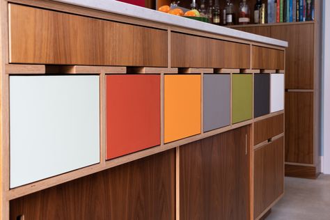 Multi-colored drawers for this kitchen lower. We love how warm the walnut feels against these color splashes. Plywood Kitchen, Modern Remodel, Cabinet Fronts, Kitchen Drawers, Shelving Systems, Unique Houses, Wall Mounted Shelves, Unusual Design, Wood Cabinets