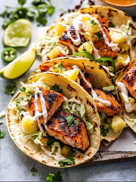 These tacos are my go-to when I'm in the mood for sweet, smoky, savory, and spicy salmon tacos. The salmon is smothered in a chipotle honey sauce, seared and Fish Taco Marinade, Chipotle Honey Sauce, Creamy Orzo Pasta, Salmon Tacos Recipe, Tacos With Pineapple Salsa, Tacos With Pineapple, Garlic Chicken Pasta, Fish Taco Sauce, Honey Salmon