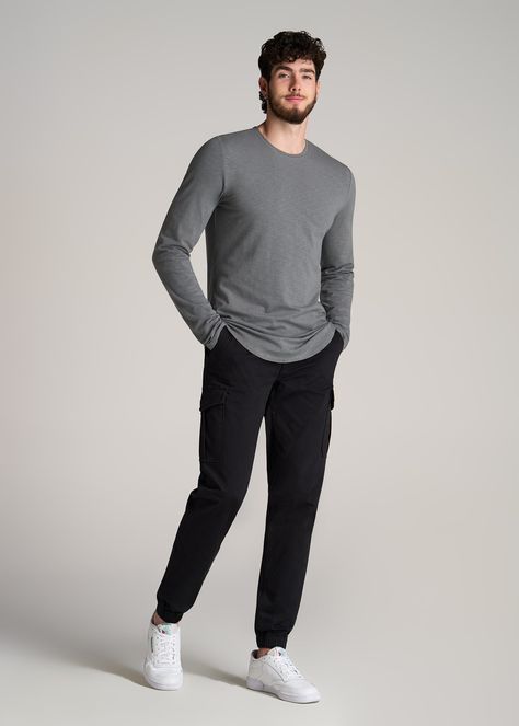 About Our Slub Long Sleeve Scoop Tall Men's Tee If you need to stock up on essentials, don’t miss out on this tall long sleeve shirt. It’s made with a stretch-infused cotton slub jersey that has a slightly textured yet supremely soft finish. The close fit is designed to sit next to the body and makes this an ideal layering or lounging piece. We made this extra long top with a scooped hem for a classic menswear feel that looks good on its own or under a sweater. This tee lands at the hip and has Mens Big And Tall Stores, Very Tall Man, Tall Mens Outfits, Tall Men’s Fashion, Slim Guys Fashion Outfit, Relaxed Fit Outfit Men, Men’s Clothing Business Casual, Outfits For Tall Guys, Tall Men Fashion Casual