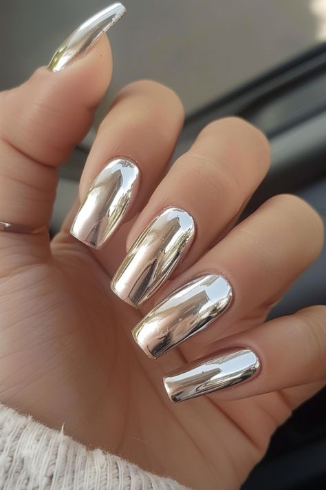 Get ready to dazzle and shine with the hottest nail trend of the season: chrome nails! This mesmerizing look is guaranteed to elevate your style and turn heads wherever you go. So, if you’re looking Chrome Sliver Nails, Mirror Nails Chrome, Chrome Nails Fall Colors, Silver And Gold Chrome Nails, Sliver Nails, Chrome Nail Designs, Nails Metallic, Stiletto Shaped Nails, Chrome Manicure