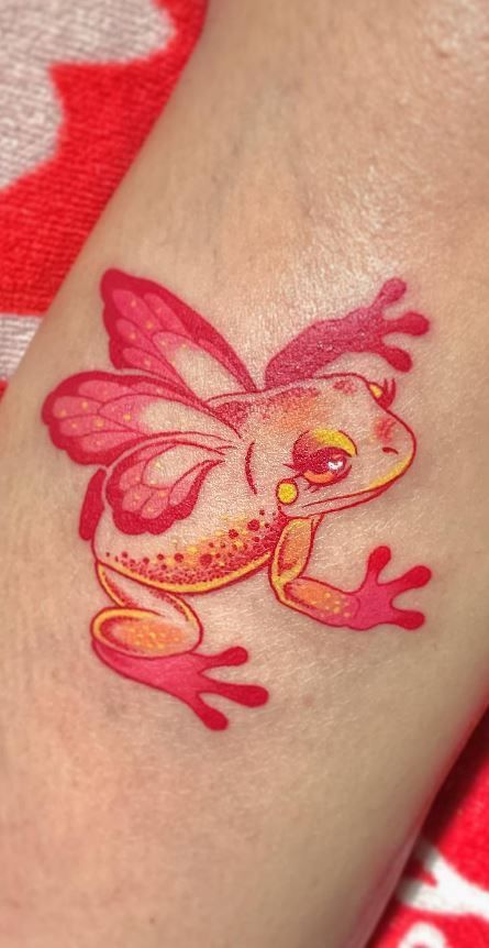 Frog Tattoo Design Cute, Colored Outline Tattoo, Color Linework Tattoo, Feminine Tattoos Color, Girly Frog Tattoo, Party Frog Tattoo, Cute Frog Tattoo Ideas, Fairy Frog Tattoo, Frog With Wings Tattoo