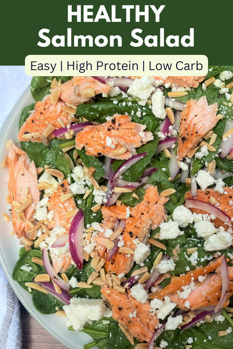 This healthy salmon salad is made with baked salmon,  a light vinagrette, fresh spinanch, red onion, feta and sliced almonds. It's a deliciously simple salad that's perfect for lunch or dinner. Salmon Salad Healthy, Best Salmon Salad Recipe, Recipes Using Lox Salmon, Healthy Salads With Protein, Mediterranean Salmon Salad, Shredded Salmon Recipes, Cold Salmon Recipes, Smoked Salmon Lunch Ideas, Salmon And Spinach Recipes