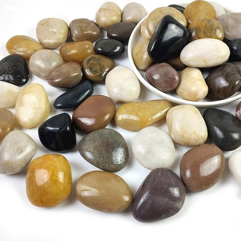 PRICES MAY VARY. 【Size And Weight】: These colorful stones measure approximately 1 to 2.2 inches and weigh 5 pounds per package. They are round and smooth colorful stones 【Natural Colorful River Rocks】: Our stones are all natural and these stones are very high quality. These colorful pebbles are hand selected, cleaned and polished, then packaged and shipped to our customers 【Wide Range Of Use Scenarios】: Colorful high polished pebbles can be used for indoor and outdoor home decoration, can be use Pebbles For Garden, Landscaping Pebbles, Colorful Pebbles, Colorful Landscaping, Decorative Stones, Garden Paving, Colorful Stones, Outdoor Fountain, Polished Pebble