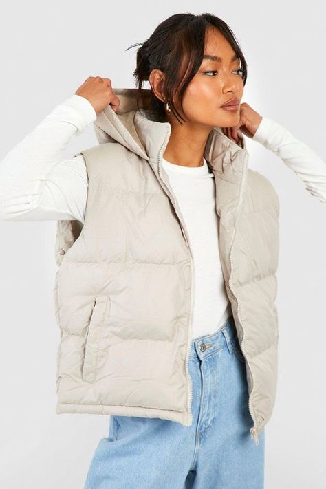 Womens Hooded Vest - Beige - 10 - Add a different type of layer to your look with this vest, a sporty and stylish piece. This sleeveless jacket closely resembles a waistcoat and is perfect for throwing over long sleeve tops, sweaters, and lightweight coats. This body warmer can add that much-needed extra insulation to your outfit during colder months without making you feel too bulky. Style this women's vest with a sports outfit, work attire, or everyday look.Style: GiletFabric: PolyesterNecklin Sleeveless Jacket Outfit, Jacket Without Sleeves, Womens Hooded Vest, Puffer Outfit, Waistcoat Designs, Hooded Gilet, Faux Fur Gilet, Sports Outfit, Fur Gilet