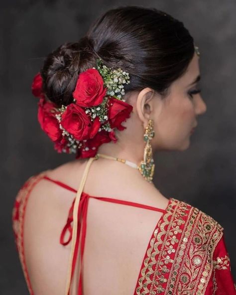 Bloom and Bun: Elegant Hairstyle Ideas for Ladies Who Love Flowers Bengali Bride Hairstyle Bun, Bun Hairstyles For Bride Indian, Bridal Bun Hairstyles Indian Flower, Bengali Bride Hairstyle, Bridal Floral Bun, Bridal Bun Hairstyles Indian, Bride Hairstyles Indian Wedding, Bridal Bun Hairstyles, Bun Elegant