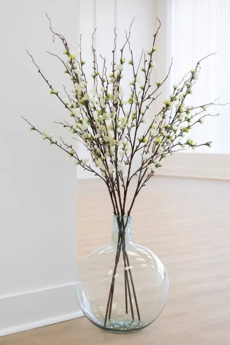 What To Put In Tall Floor Vases, Big Glass Vase Decorating Ideas, Decorative Floor Vases Living Room, Green Vase Decorating Ideas, Stems In Vases, Giant Vase Decor Ideas, Tall Vase Arrangements For Home, Large Floor Vase Arrangements, Large Glass Vase Ideas