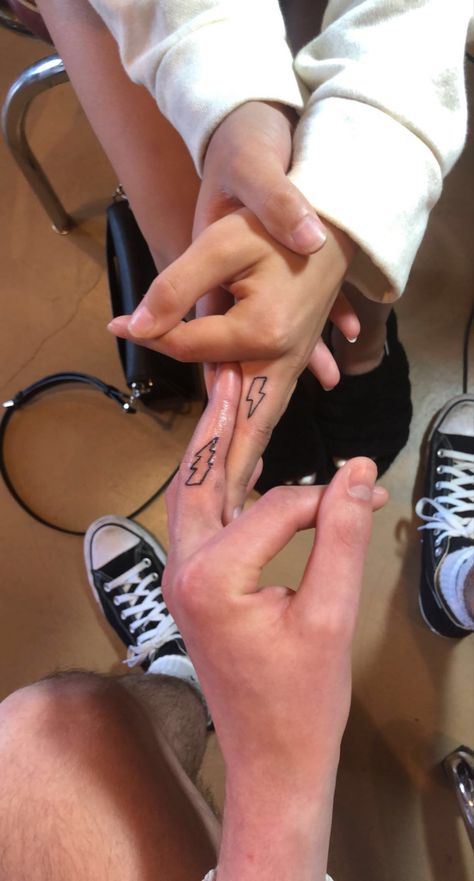 Matching finger tattoo lightning bolt facing each other Lightnight Bolt Tattoo, Tattoos Lightning, Finger Tattoos For Couples, Lightning Bolt Tattoo, Best Couple Tattoos, Lightning Tattoo, Bolt Tattoo, Tattoo Cute, Tiny Tattoo